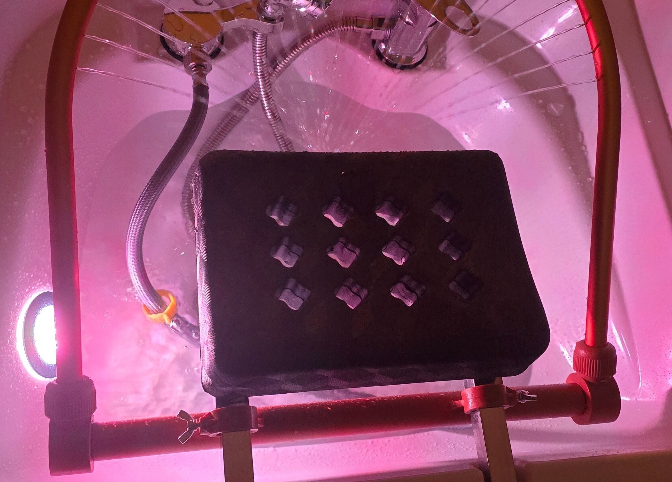 Relaxing foot bath setup at Inner Beauty by Kirsty, Carrickfergus, Northern Ireland, GB with soothing pink lighting.