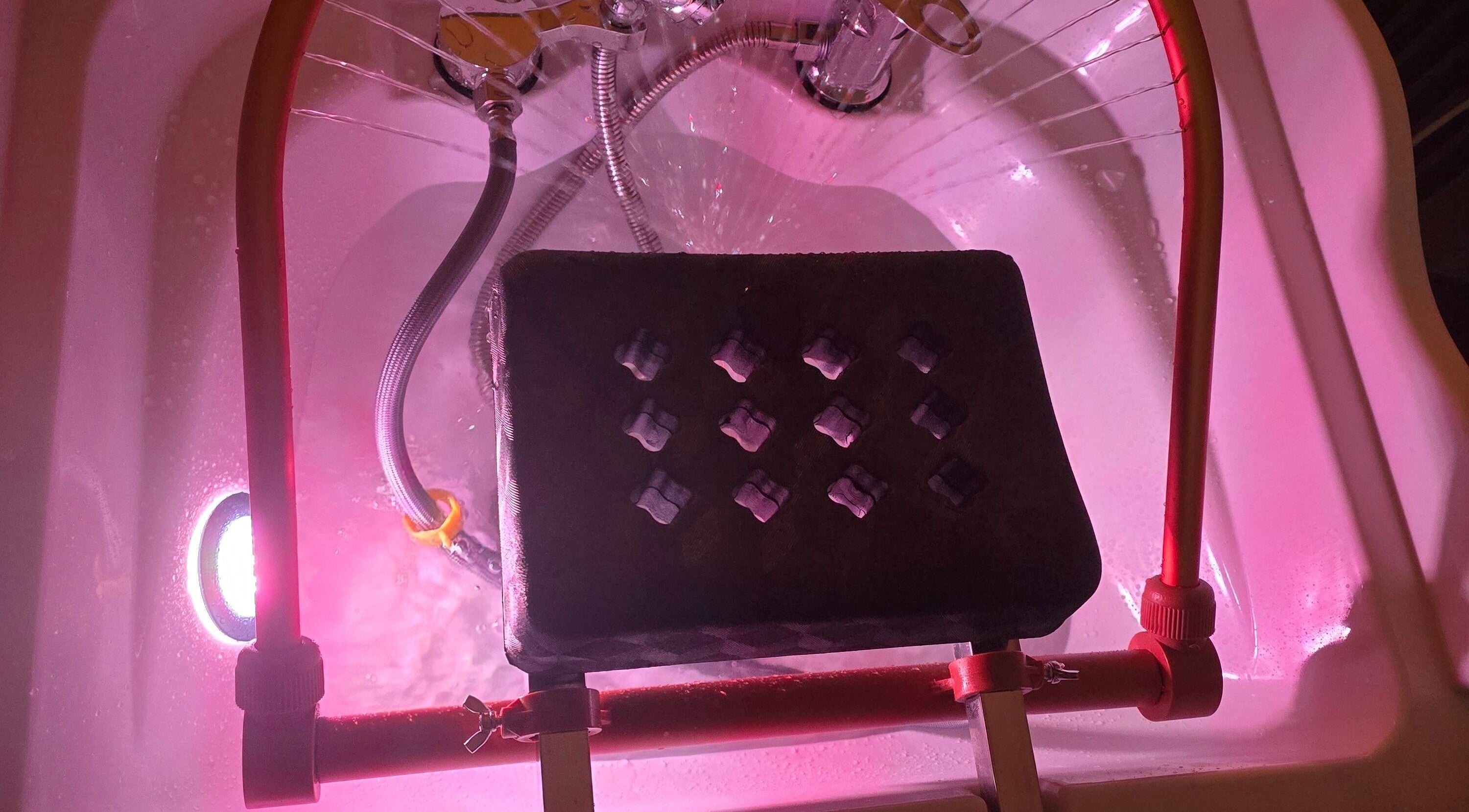 Relaxing foot bath setup at Inner Beauty by Kirsty, Carrickfergus, Northern Ireland, GB with soothing pink lighting.