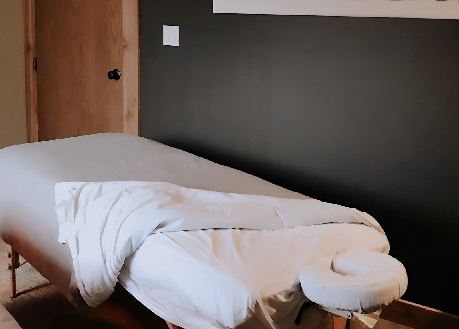 Relaxing massage bed at Cedar & Sage Co, Banff, Alberta, CA, offering a soothing wellness experience.