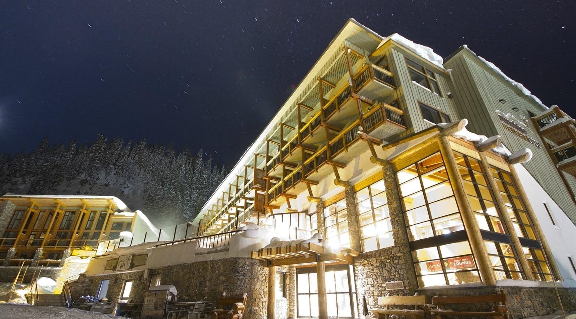 Cedar & Sage Sunshine Village in Banff, Alberta, CA under a stunning starry night sky.