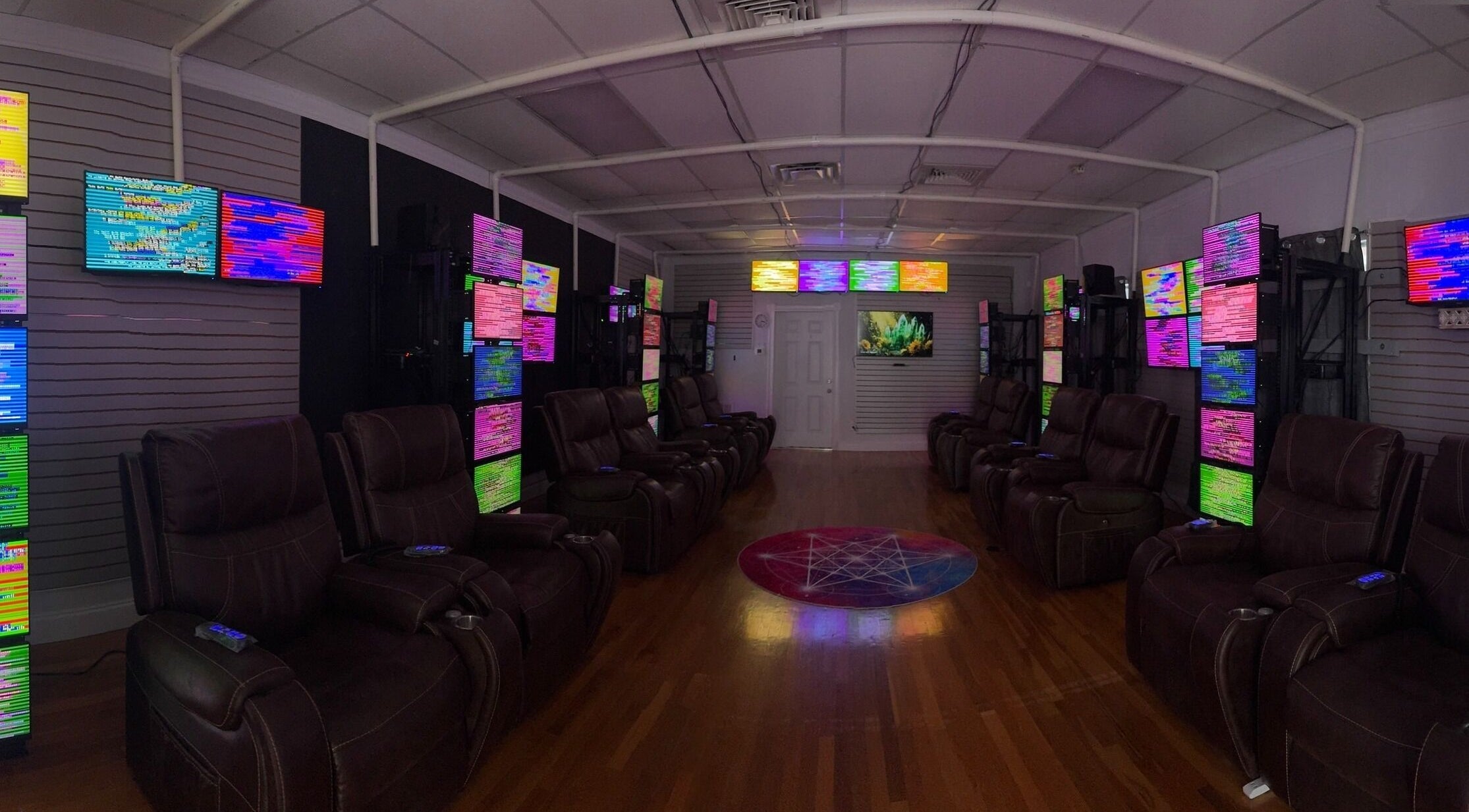 Relaxing chromotherapy lounge at Aurora Healing in Tarpon Springs, Florida, US with plush seating.