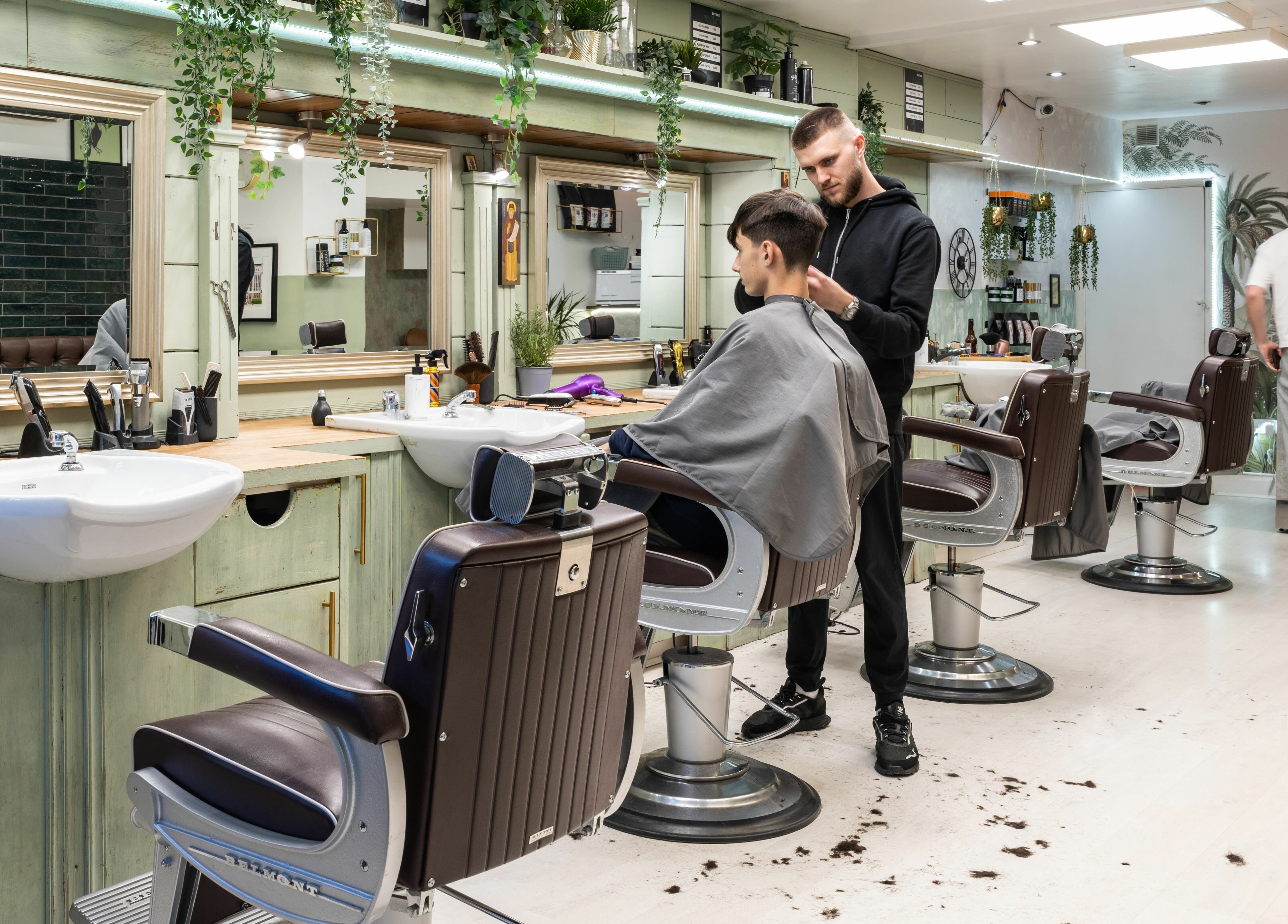 Stylish barbershop interior at Saints Barbers Crouch End, London, England, GB, showcasing modern design and grooming.