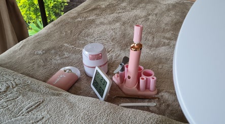 Beauty tools and devices on a plush towel at LavishYou, Durban, Kwazulu-natal, ZA.