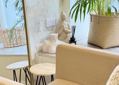 Calm and inviting seating area at Roots & Rituals Salon Inverness, Scotland, GB with plants and decor.
