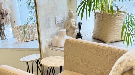 Calm and inviting seating area at Roots & Rituals Salon Inverness, Scotland, GB with plants and decor.