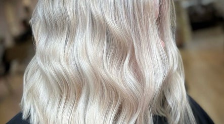 Elegant platinum blonde hair waves styled at Roots & Rituals Salon Inverness, Inverness, Scotland, GB.