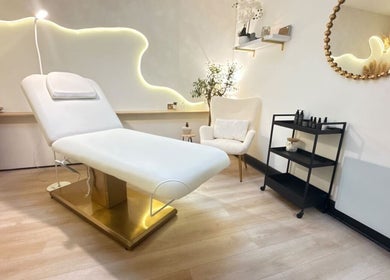 Elegant treatment room at Roots & Rituals Salon Inverness, Scotland, GB featuring a comfortable spa bed and tranquil decor.