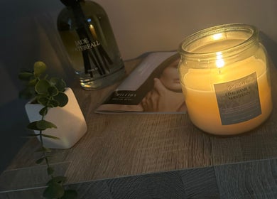 Lit candle with relaxing decor at The Head Spa Suite, Inverness, Scotland, GB.