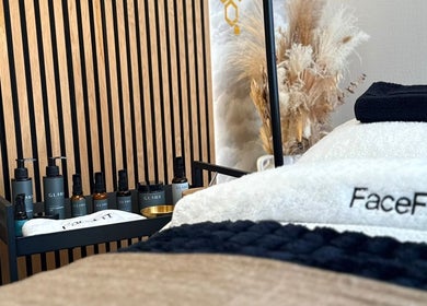 Luxurious massage table with premium products at Roots & Rituals Salon Inverness, Inverness, Scotland, GB.