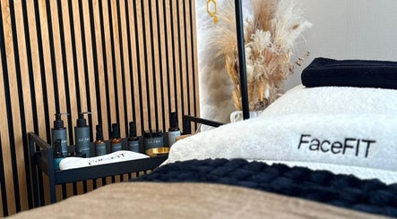 Luxurious massage table with premium products at Roots & Rituals Salon Inverness, Inverness, Scotland, GB.