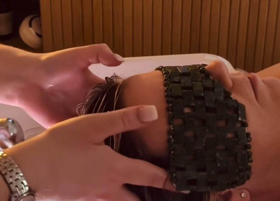 Customer enjoying a rejuvenating head massage at The Head Spa Suite, Inverness, Scotland, GB.