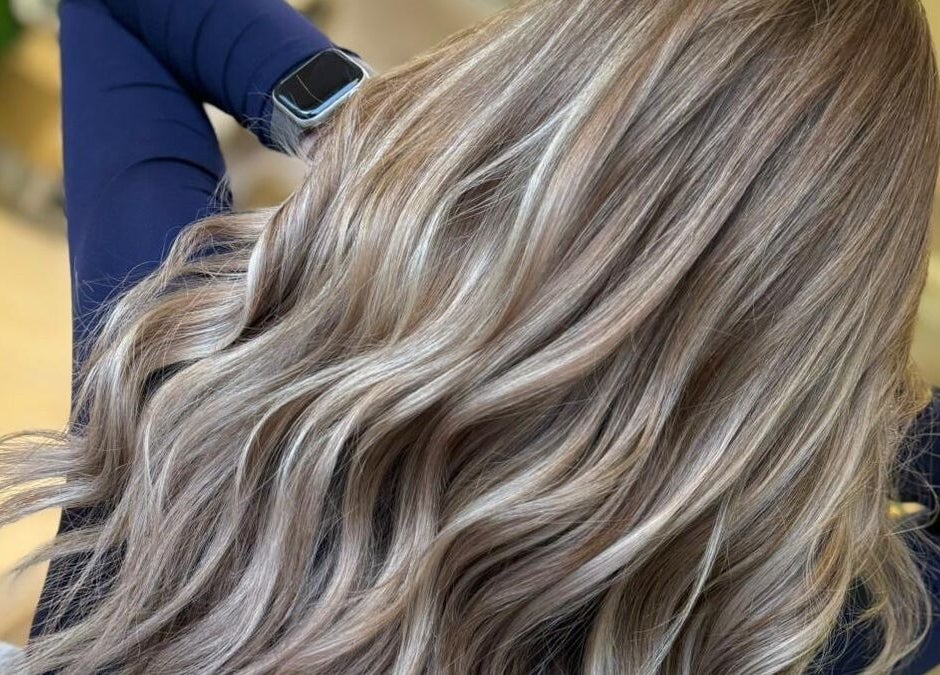 Flowing blonde hair styled at Roots & Rituals Salon Inverness, Scotland, GB, showcasing expert hairdressing skills.