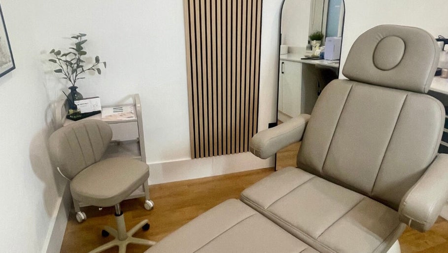 Calm treatment room at Aesthetics by Hayley in London, England, GB featuring a comfortable chair and decor.