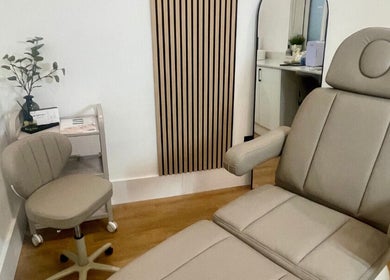 Calm treatment room at Aesthetics by Hayley in London, England, GB featuring a comfortable chair and decor.