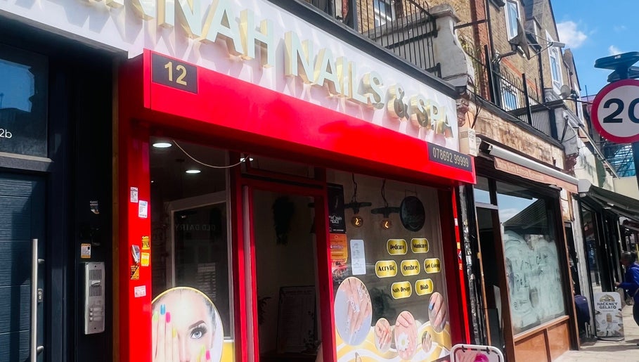 Front of Glimmerbeauty in London, England, GB, featuring bright red and white signage.