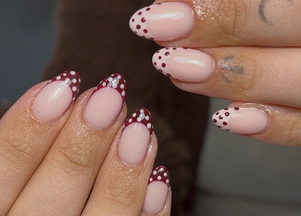 Elegant polka dot nail art at Nails by Mia in Worksop, England, GB, showcasing intricate design details.