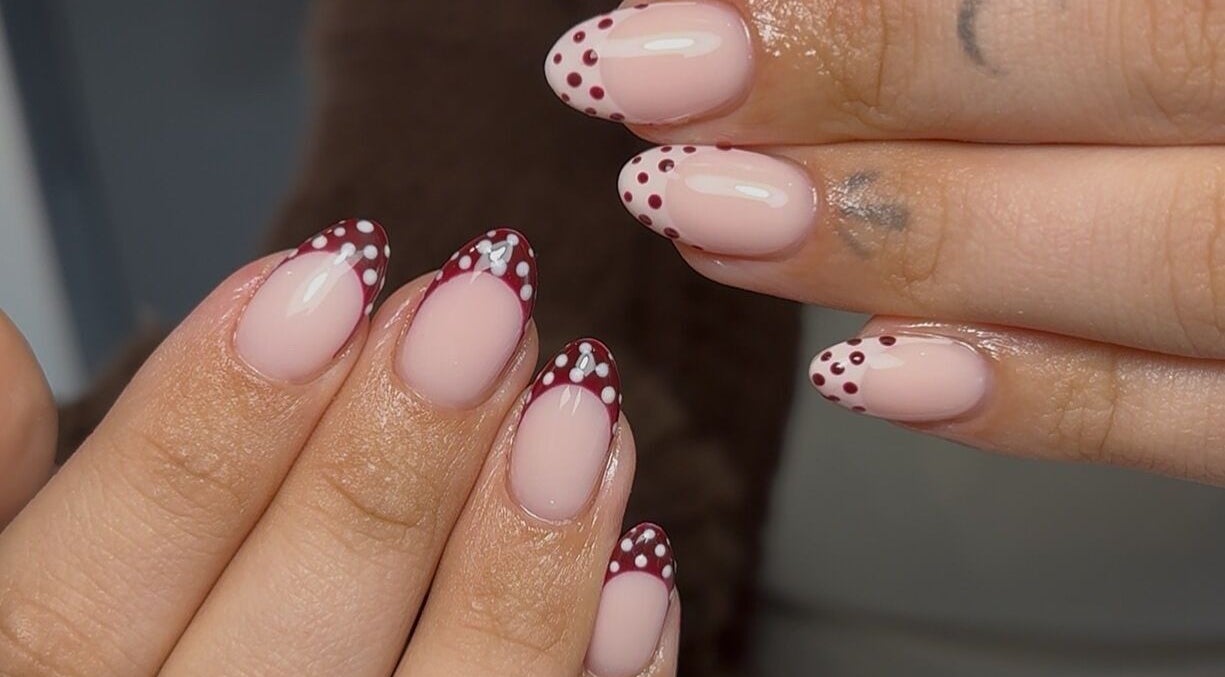 Elegant polka dot nail art at Nails by Mia in Worksop, England, GB, showcasing intricate design details.