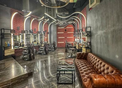 Interior of Bekky Barber - Marina View in Dubai, Dubai, AE. Stylish modern design with sleek barber chairs.
