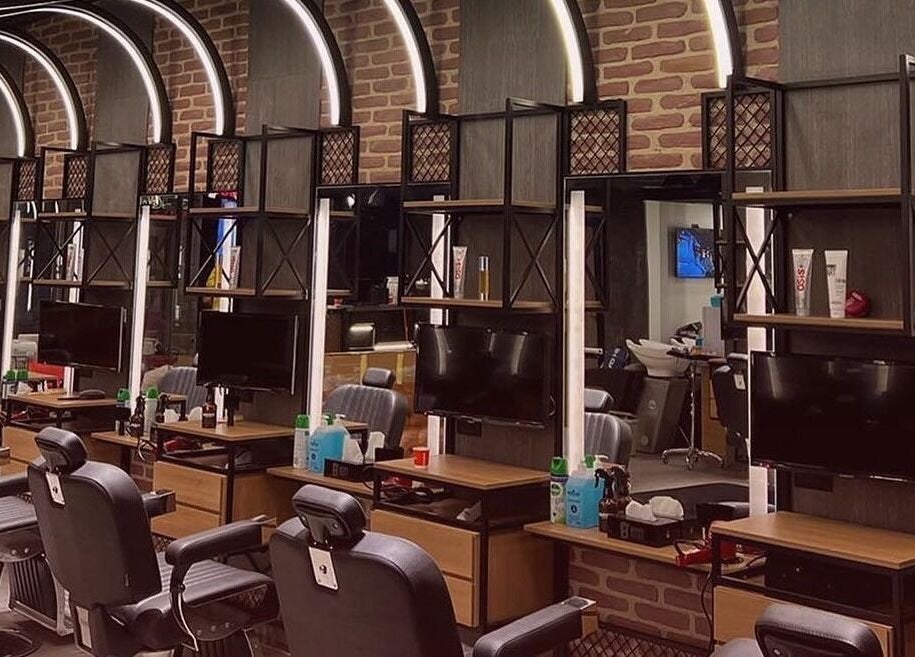 Modern barber station at Bekky Barber - The Valley, 'ud Al Bayda', Dubai, AE featuring sleek black chairs.