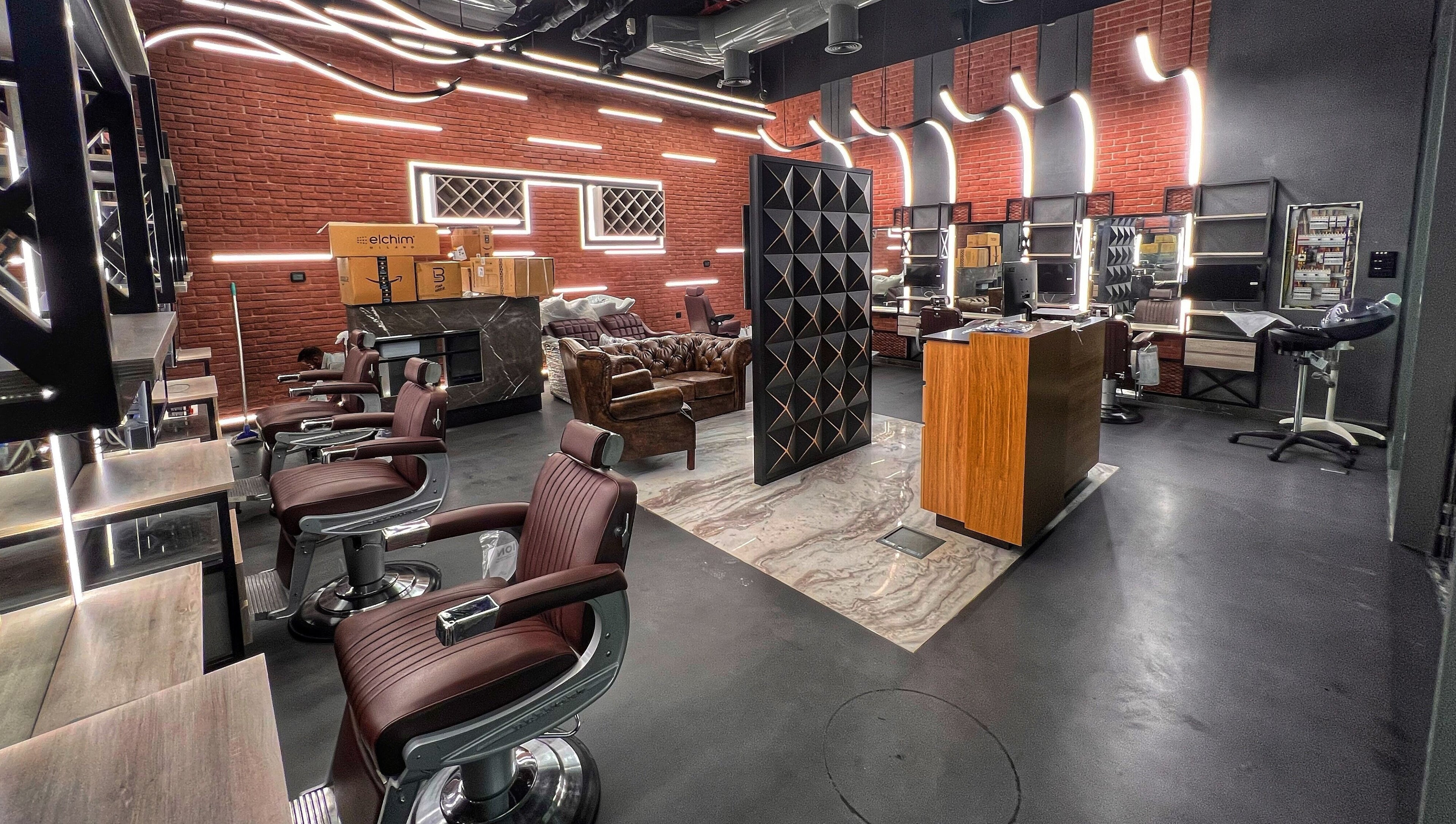 Stylish interior of Bekky Barber - Beach Front in Dubai, AE showcasing modern barber chairs and sleek decor.