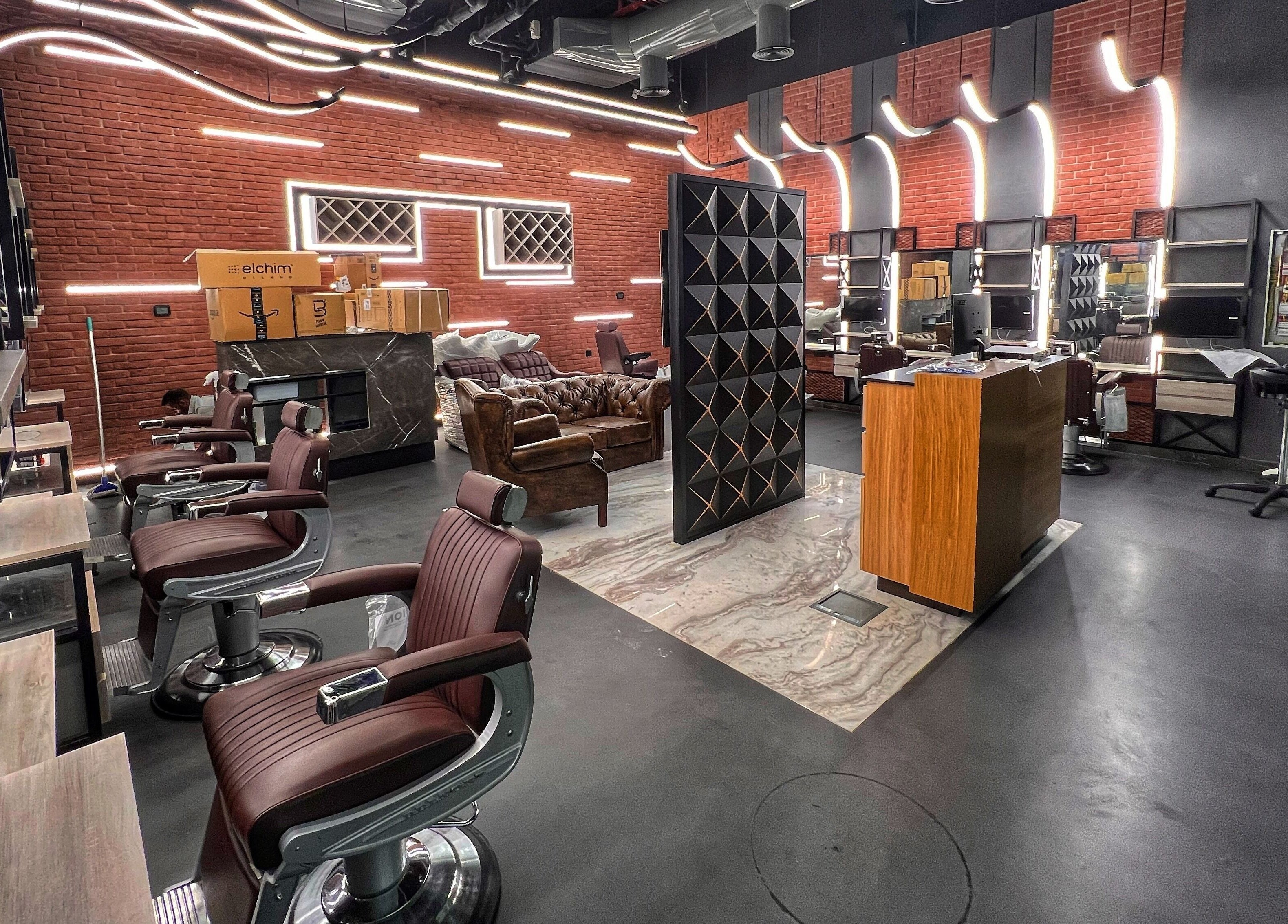 Stylish interior of Bekky Barber - Beach Front in Dubai, AE showcasing modern barber chairs and sleek decor.