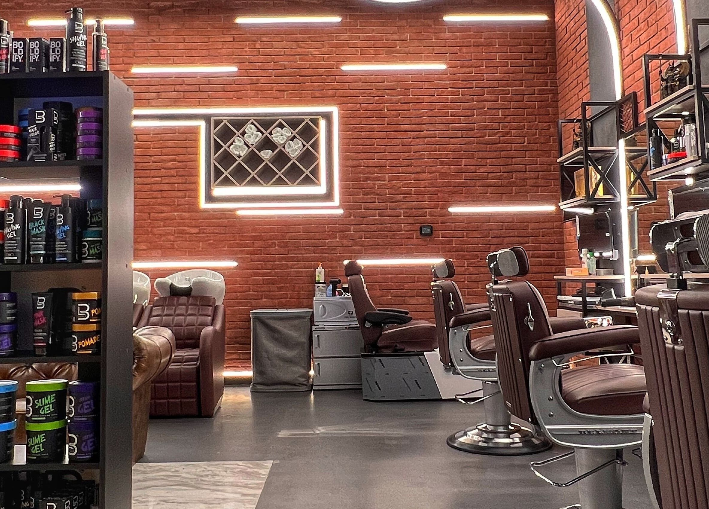 Modern barber shop interior at Bekky Barber - Beach Front in Dubai, AE with sleek chairs and stylish lighting.