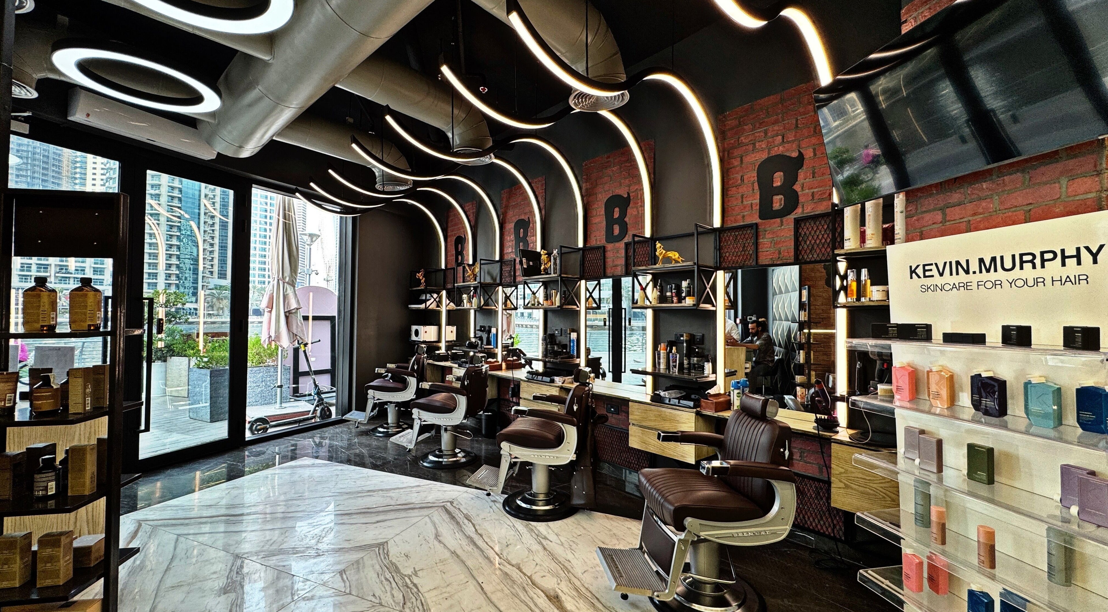 Stylish interior of Bekky Barber - Marina View in Dubai, Dubai, AE, showcasing barber chairs and modern decor.