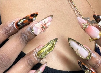 Intricate floral nail art on hand at Fitzroy - Mitty Nails & Beauty, Melbourne, Victoria, AU.