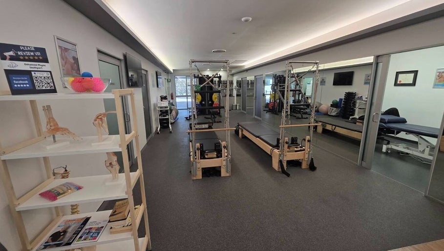 Therapy room at Thai Fusion Remedial Massage in Southport, Queensland, AU, with Pilates equipment and serene ambiance.
