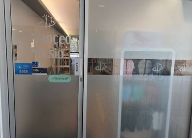 Entrance of Thai Fusion Remedial Massage in Southport, Queensland, AU with glass door and logo.