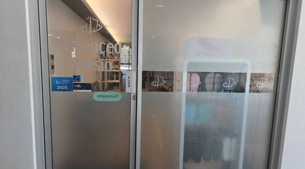 Entrance to Thai Fusion Remedial Massage in Southport, Queensland, AU with glass doors and signage.