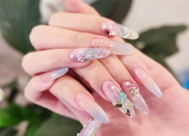 Elegant nail art design at Nail Monster, Brookline, Massachusetts, US showcasing intricate details and soft colors.
