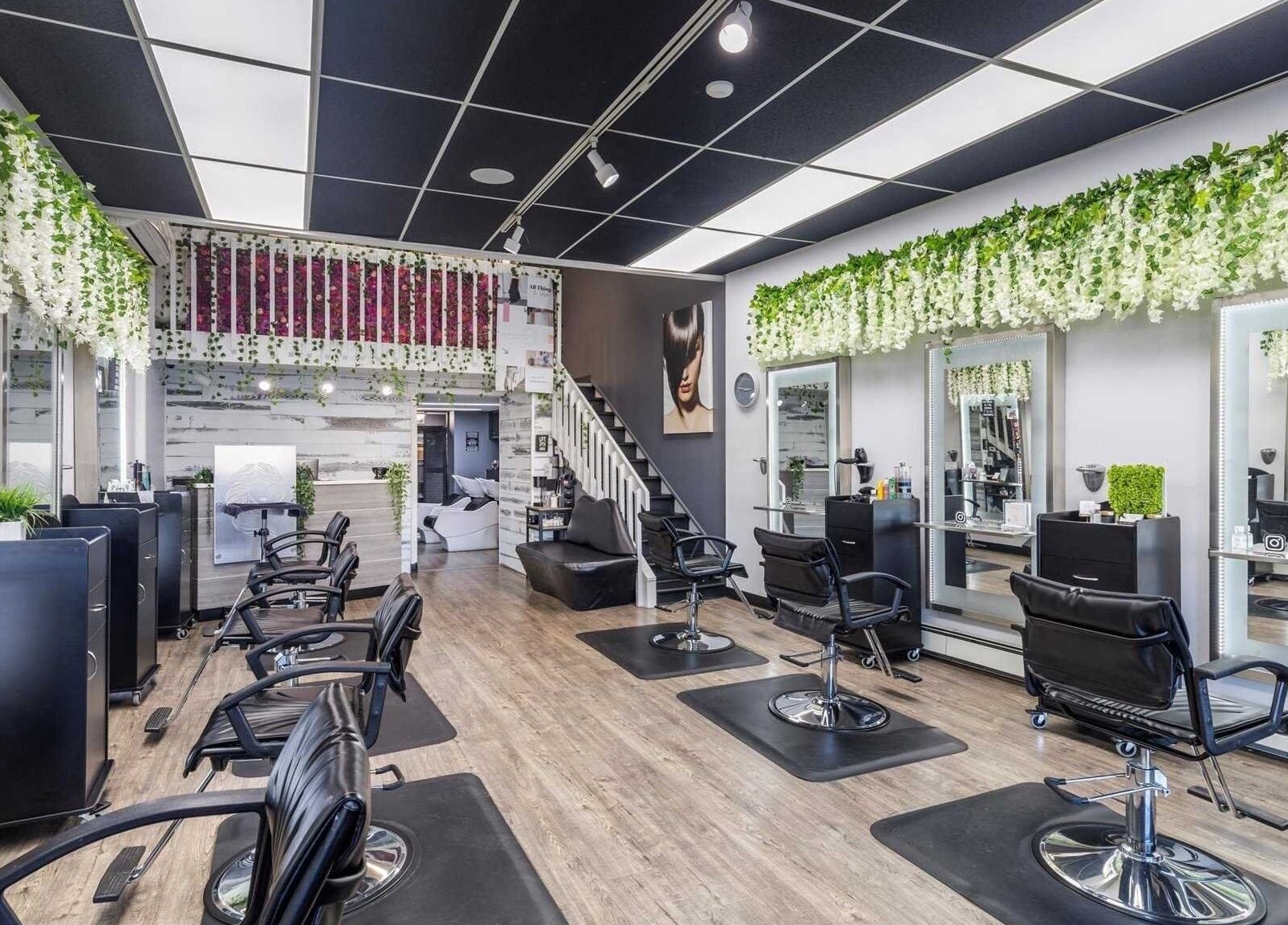 Modern interior of Michele’s Station Square Hair Salon in Rutherford, New Jersey, US with stylish decor and seating.