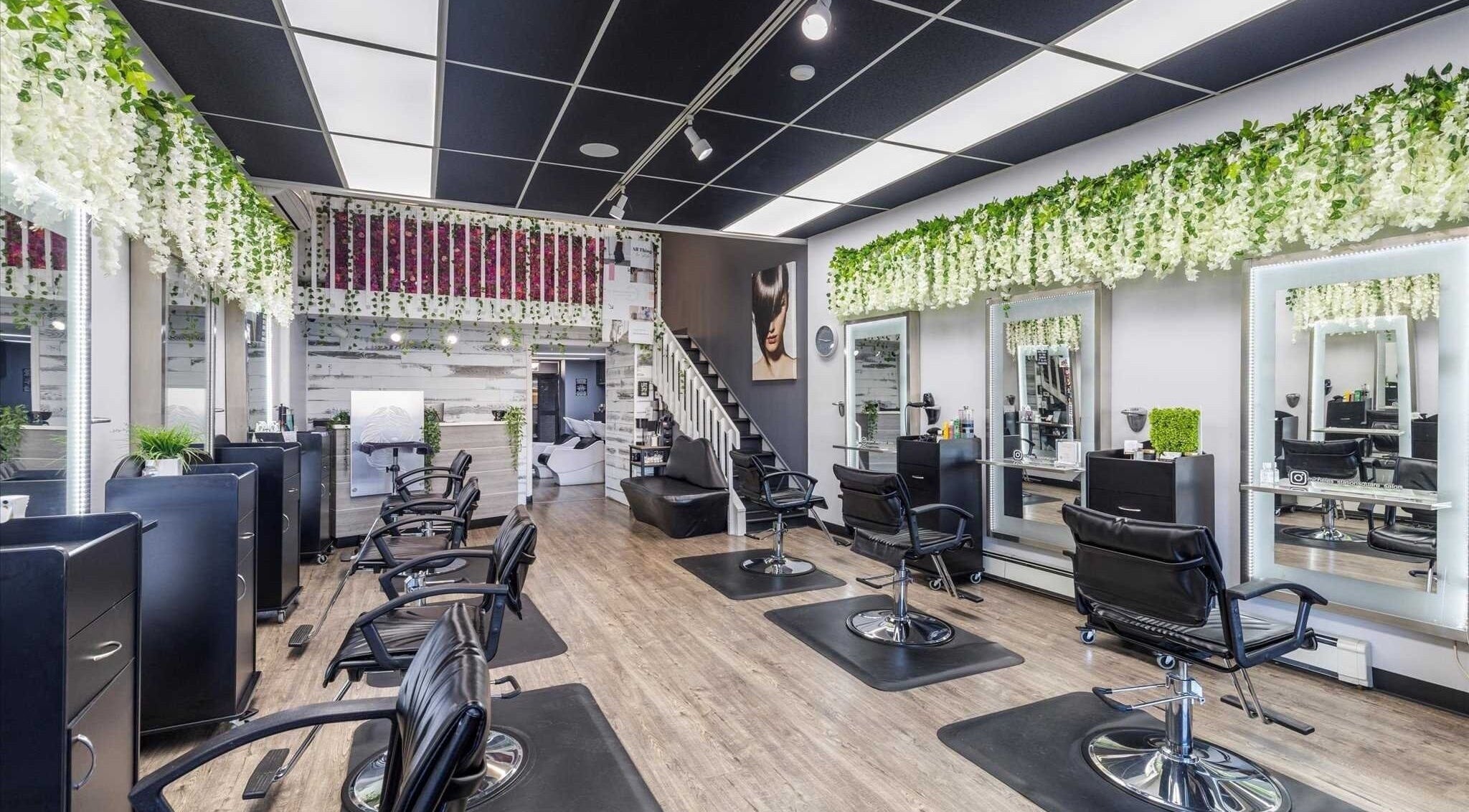 Modern interior of Michele’s Station Square Hair Salon in Rutherford, New Jersey, US with stylish decor and seating.