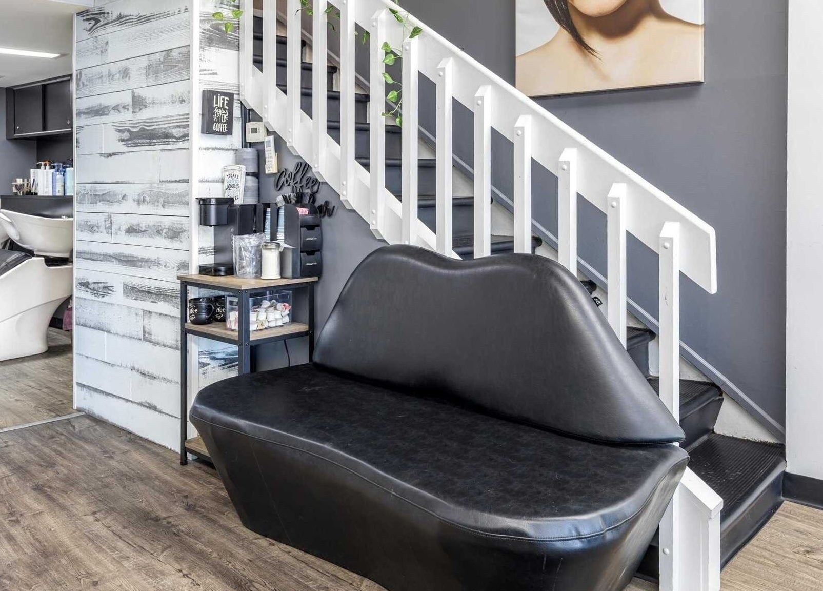 Modern interior of Michele’s Station Square Hair Salon in Rutherford, New Jersey, US with sleek seating and decor.
