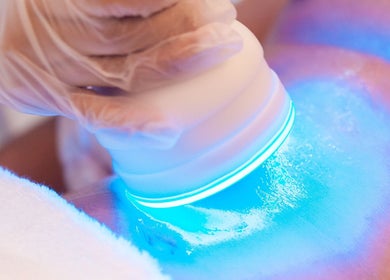 CryoGlow therapy at CRYO Hong Kong on Hong Kong Island, HK, featuring blue light treatment on skin.