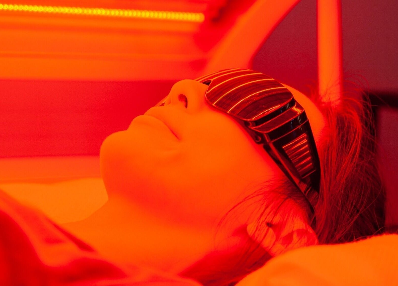 Individual enjoys red light therapy at CRYO Hong Kong, Hong Kong Island, HK for wellness enhancement.