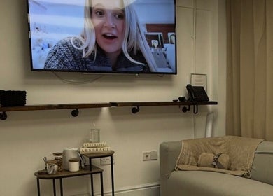 Cozy lounge at Beauty by Dionne featuring a wall-mounted TV, Stockport, England, GB.