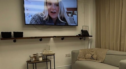 Cozy lounge at Beauty by Dionne featuring a wall-mounted TV, Stockport, England, GB.
