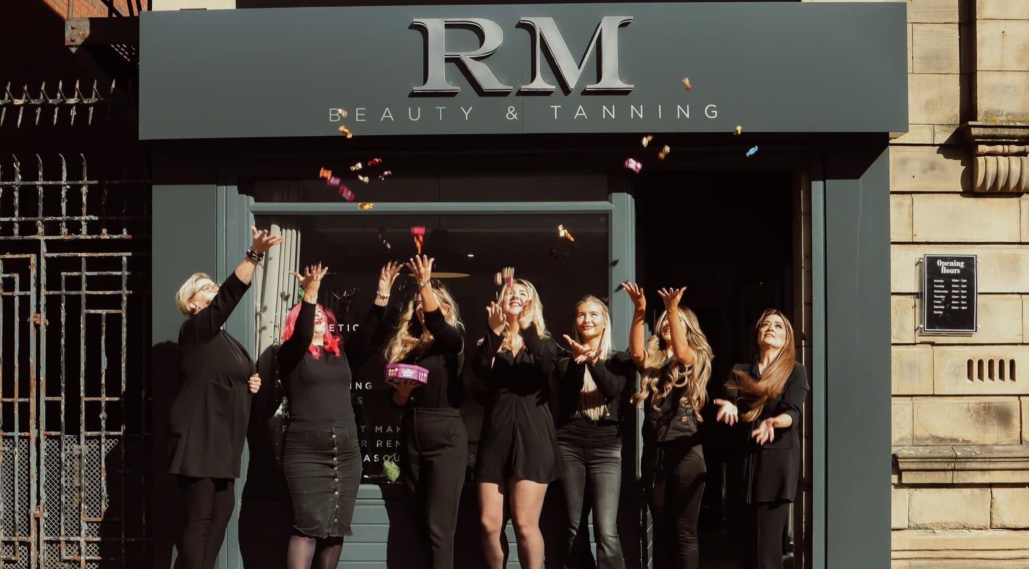 Team celebration at Glowmeup, Rochdale, England, GB highlighting beauty and wellness services.