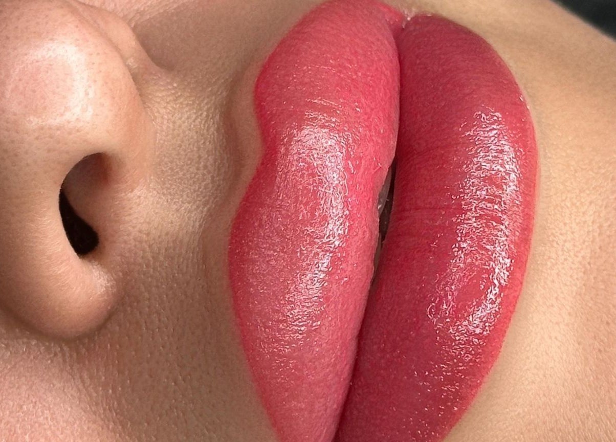 Close-up of glossy lips showcasing beauty treatment at Glowmeup, Rochdale, England, GB.