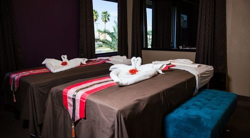 Relaxing massage tables at Sawasdee Thai Spa in Las Vegas, Nevada, US with elegant towel decorations and calming decor.