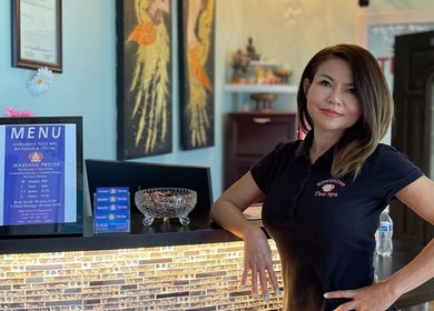 Friendly staff at Sawasdee Thai Spa in Las Vegas, Nevada, US, showcasing relaxing ambiance and service menu.