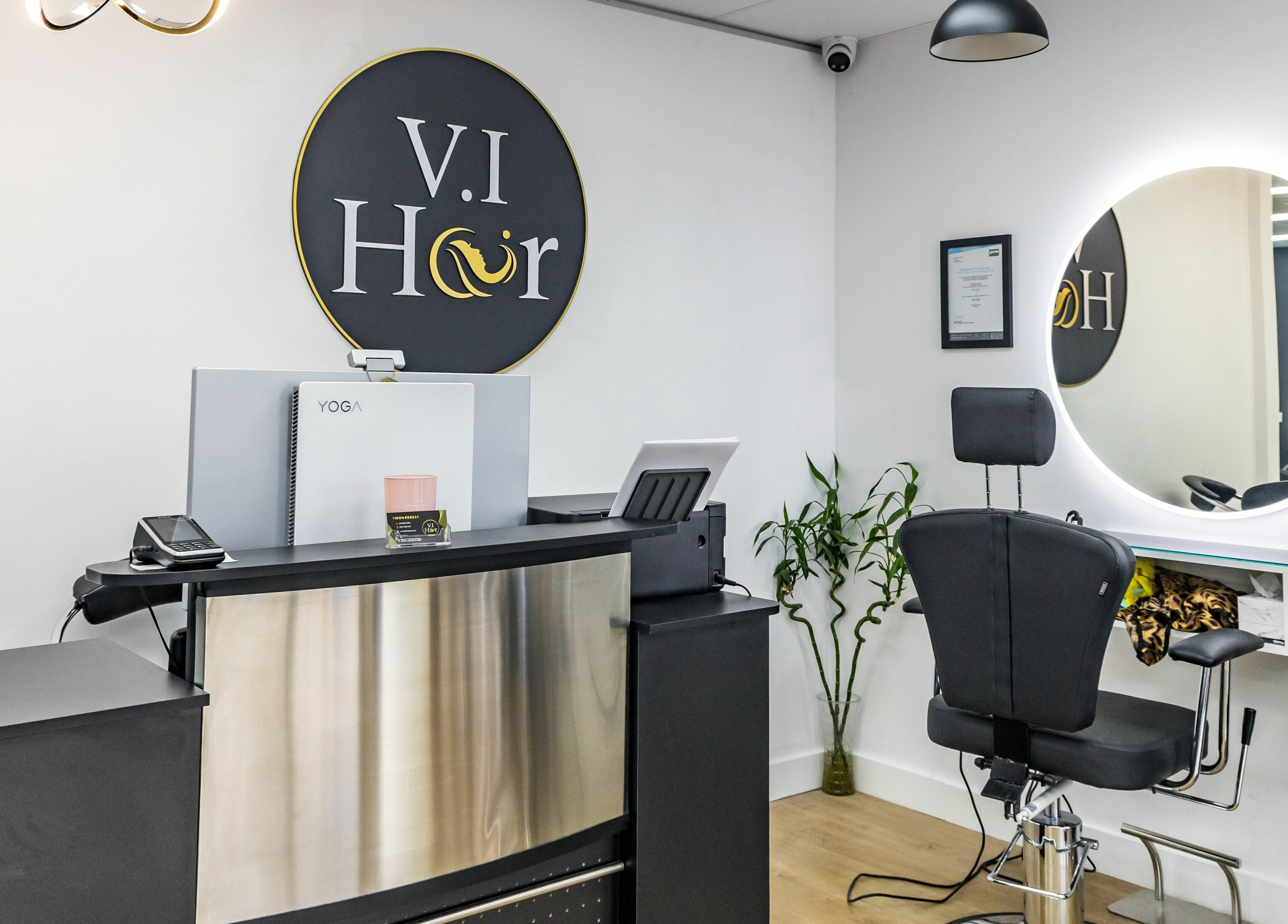 Reception at V.I Hair, Melbourne, Victoria, AU, features sleek modern design and welcoming decor.