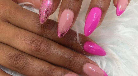 Vibrant pink and nude nail art at O'riain Beauty, Pretoria, Gauteng, ZA on chic, manicured hands.