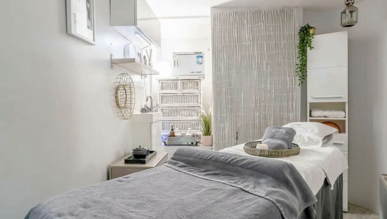 Tranquil treatment room at Wellness Skin & Laser Centre, London, England, GB with soft lighting and cozy bed.