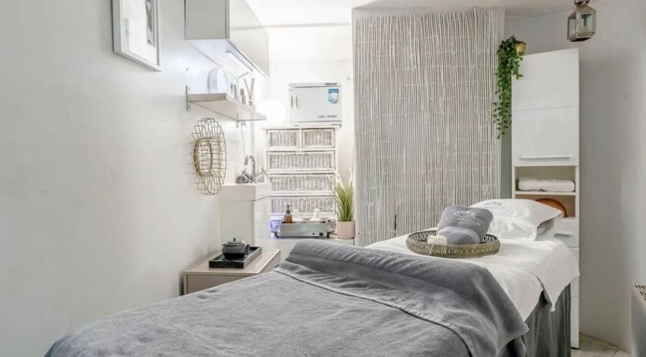 Tranquil treatment room at Wellness Skin & Laser Centre, London, England, GB with soft lighting and cozy bed.