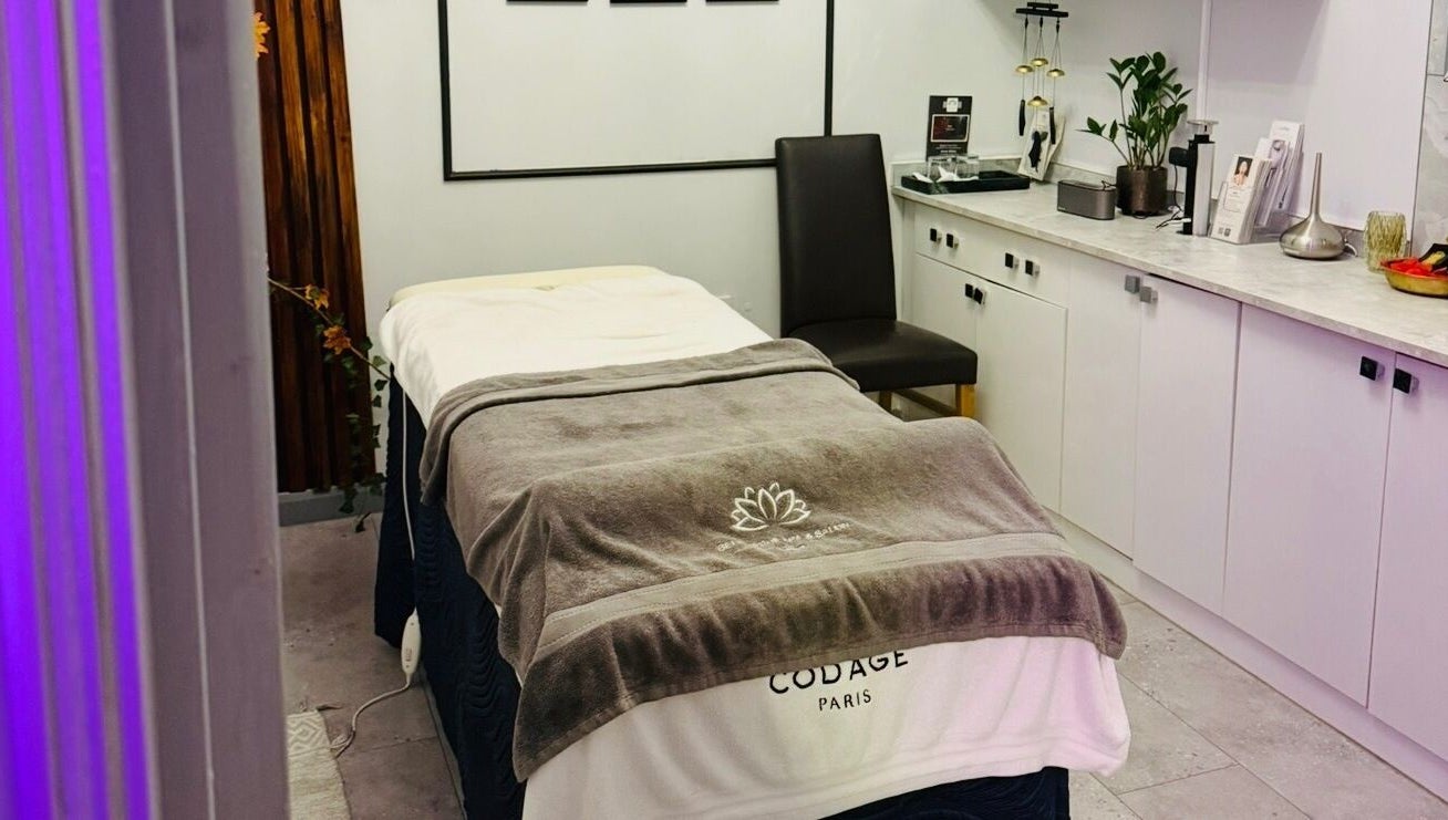 Cozy spa room at Belle Vous Spa Nine Elms, London, England, GB with massage bed and serene decor.