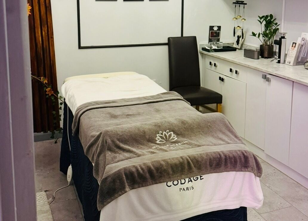 Cozy spa room at Belle Vous Spa Nine Elms, London, England, GB with massage bed and serene decor.
