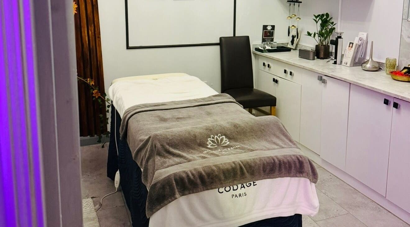 Cozy spa room at Belle Vous Spa Nine Elms, London, England, GB with massage bed and serene decor.